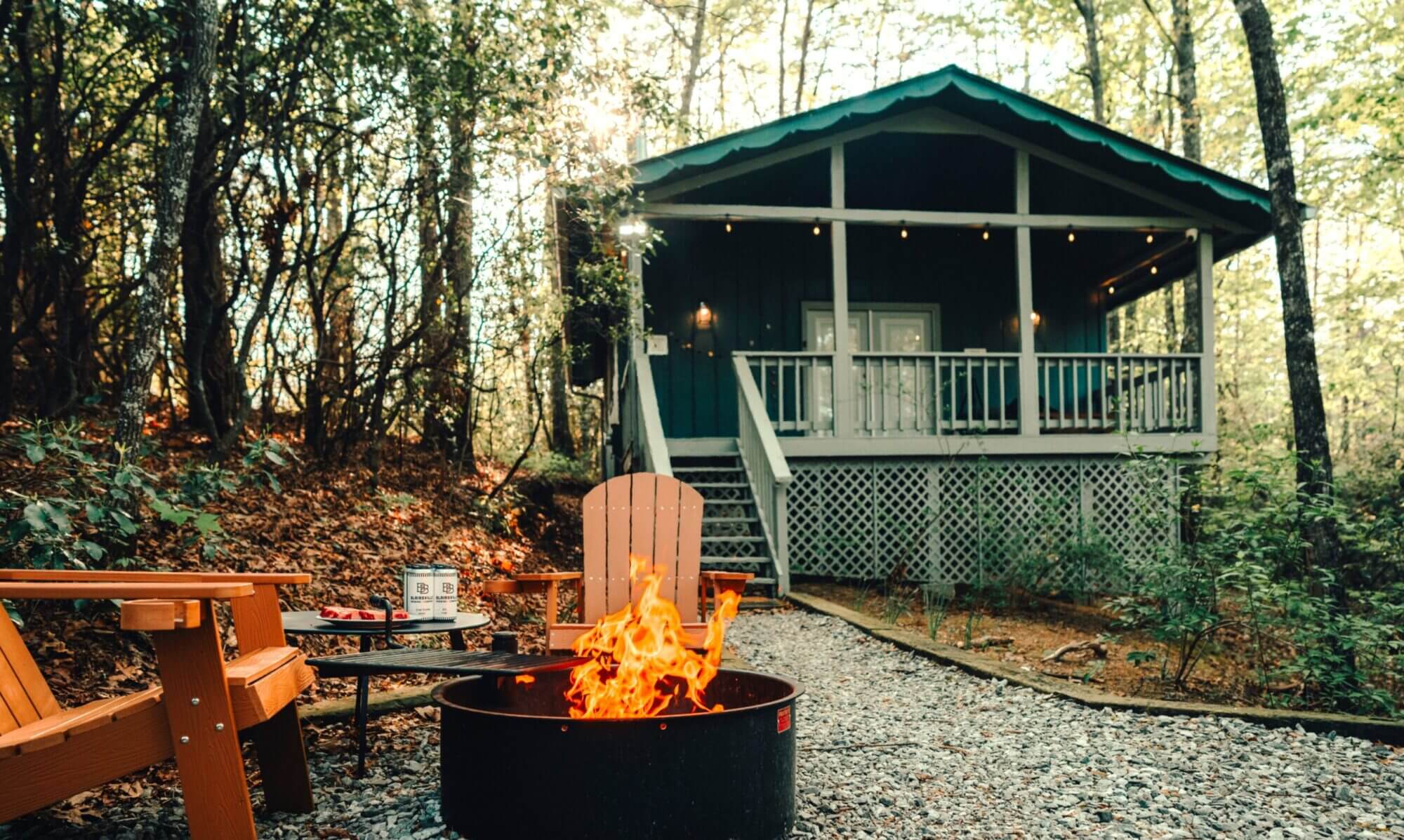 Exterior view of Adohi Cabin, a boho modern romantic getaway in North Georgia fire pit